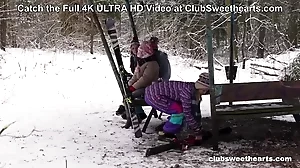 Two petite lesbians have outdoor fun in the snow while wearing bunny suits